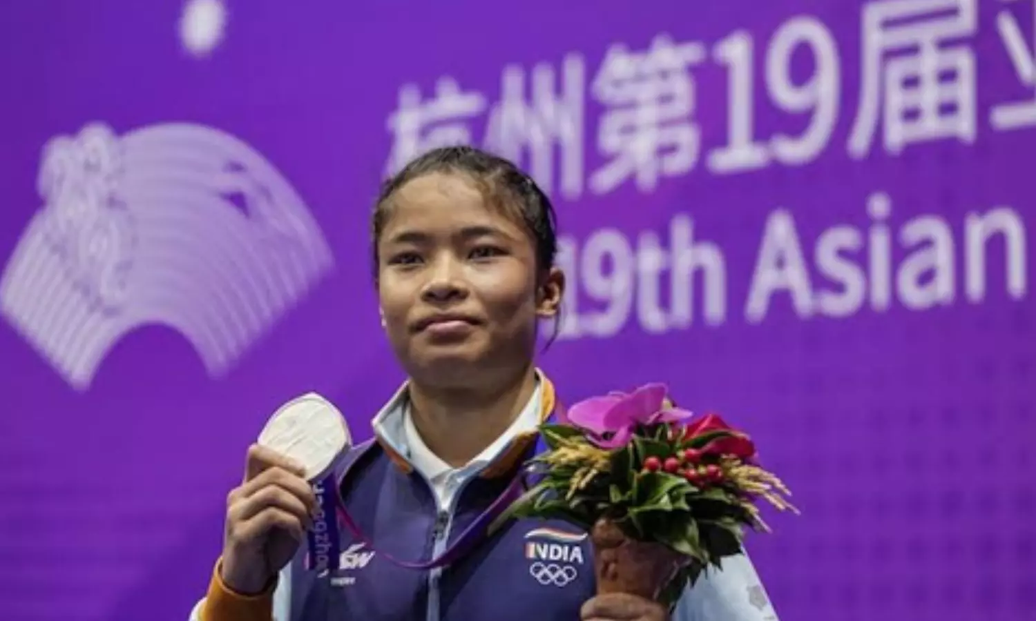 Indias Roshibina Devi confirmed her third medal at the Asian Games after securing a 5-0 win Indias Roshibina Devi confirmed her third medal at the Asian Games after securing a 5-0 win