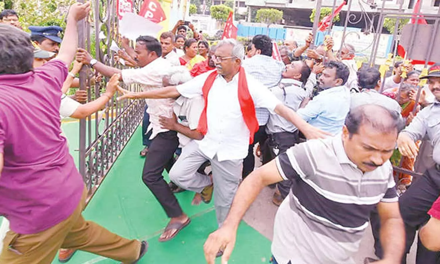 CPM State secretariat member Ch Baburao enters the Vijaya Dairy premises along with party leaders and activists during the protest against the milk price hike at Chittinagar in Vijayawada on Tuesday CPM State secretariat member Ch Baburao enters the Vijaya Dairy premises along with party leaders and activists during the protest against the milk price hike at Chittinagar in Vijayawada on Tuesday