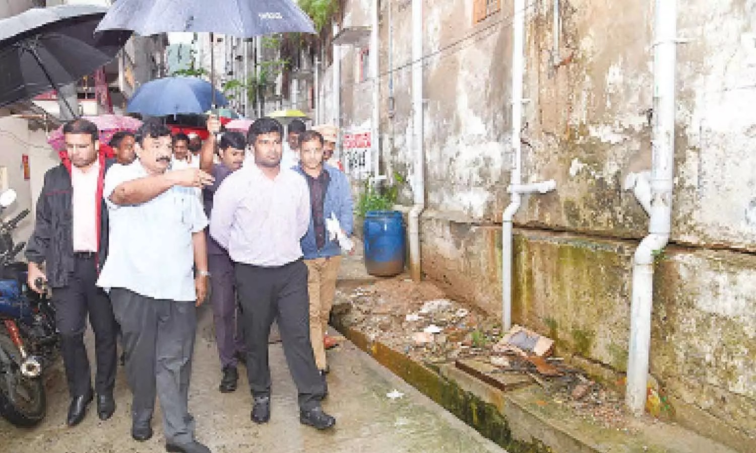 As part of the field visit during rains, District Collector M Abhishikth Kishore, GVMC Commissioner Ketan Garg and MLA P Vishnu Kumar Raju examining the condition at Vambay Colony in Visakhapatnam on Wednesday As part of the field visit during rains, District Collector M Abhishikth Kishore, GVMC Commissioner Ketan Garg and MLA P Vishnu Kumar Raju examining the condition at Vambay Colony in Visakhapatnam on Wednesday