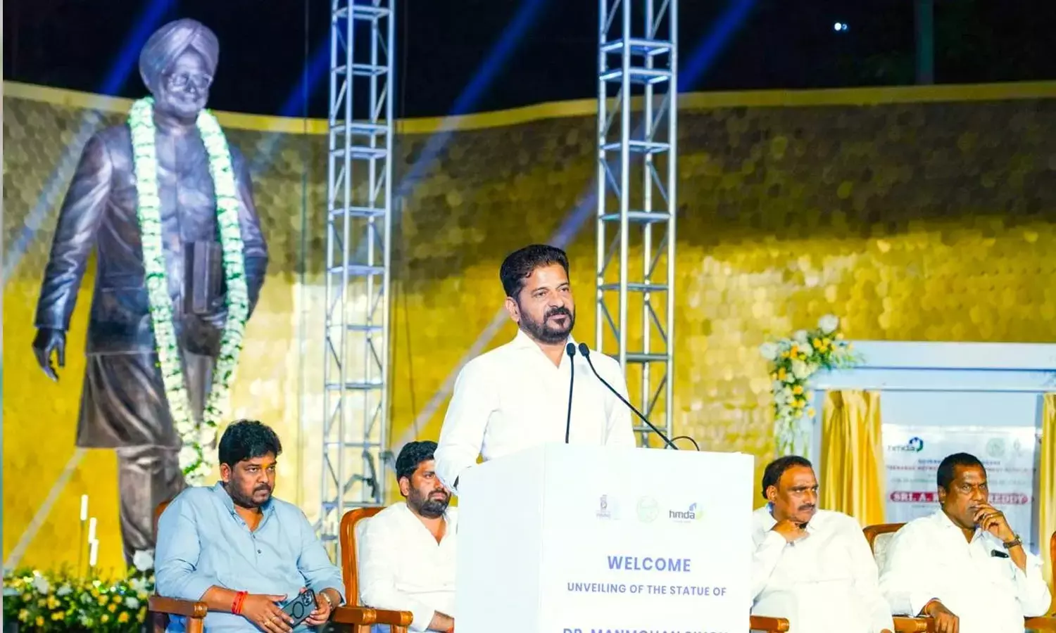 Chief Minister A Revanth Reddy addressing a gathering after unveiling a statue of former PM Manmohan Singh at Wipro Circle in Hyderabad on Saturday
