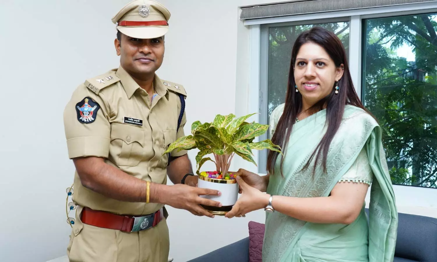 SP Jagadeesh Adahalli presenting a sapling to the district collector Krithika Shula in Narasaraopet on Friday SP Jagadeesh Adahalli presenting a sapling to the district collector Krithika Shula in Narasaraopet on Friday