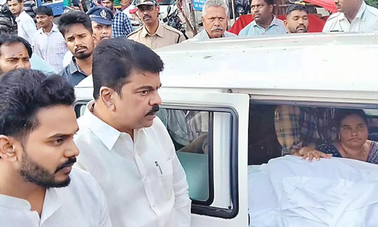Government Whip and Vijayawada Central MLA Bonda Uma Maheswara Rao and Gannavaram MLA Yarlagadda Venkata Rao pay tributes to the mortal remains of Nunna CI Ahmed Ali at a government hospital on Sunday Government Whip and Vijayawada Central MLA Bonda Uma Maheswara Rao and Gannavaram MLA Yarlagadda Venkata Rao pay tributes to the mortal remains of Nunna CI Ahmed Ali at a government hospital on Sunday