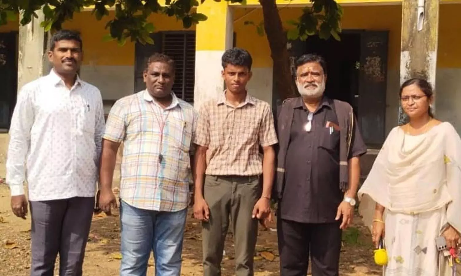 Urban MEO MVM Subrahmanyam, school in-charge headmaster Subbarao and others congratulating Veerendra on his achievement Urban MEO MVM Subrahmanyam, school in-charge headmaster Subbarao and others congratulating Veerendra on his achievement