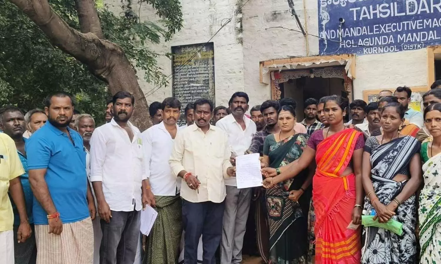 Parents after boycotting the SMC polls staging a protest in front of Holagunda Tahsildar office on Tuesday Parents after boycotting the SMC polls staging a protest in front of Holagunda Tahsildar office on Tuesday