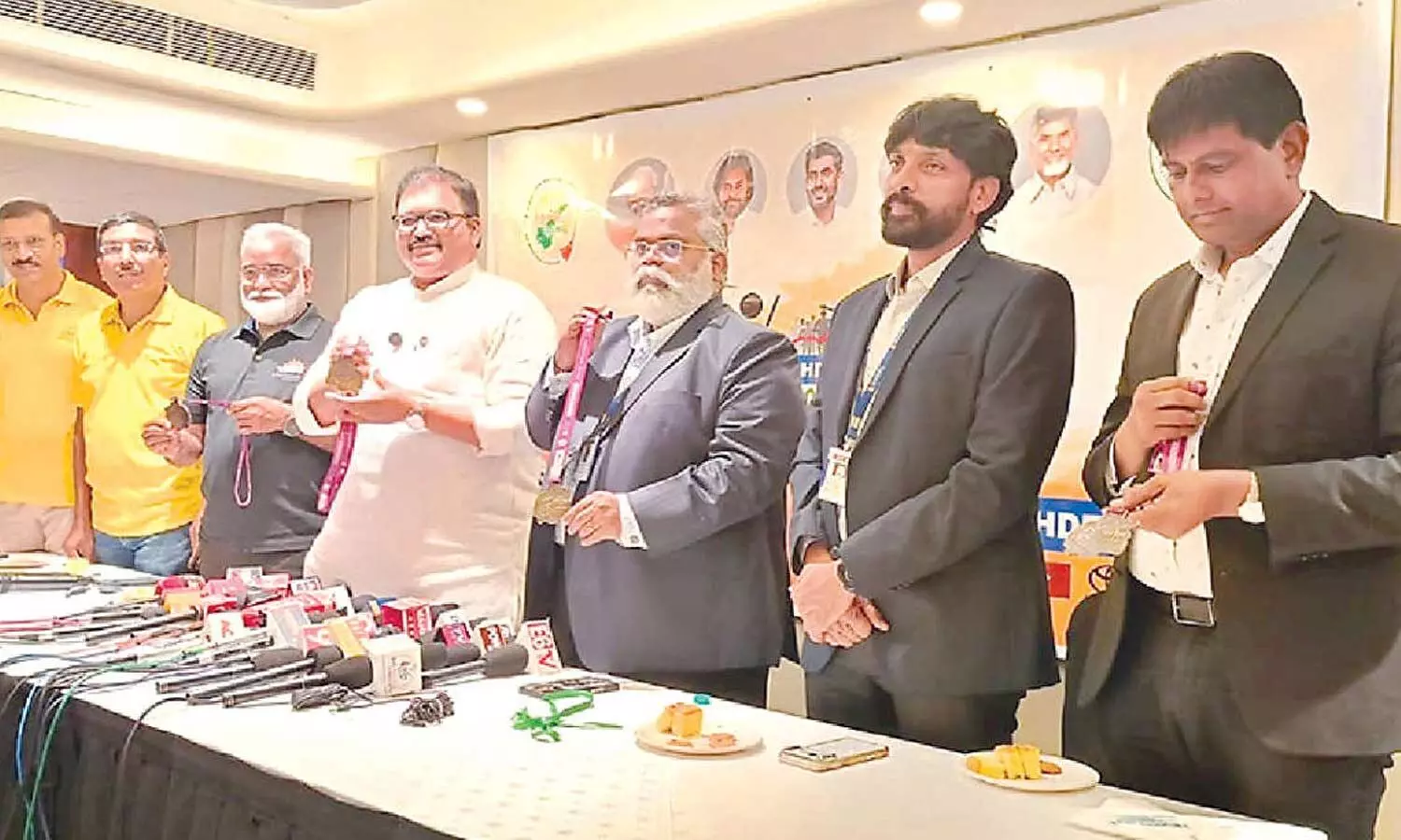 Swachha Andhra Corporation Chairman Kommareddy Pattabhi Ram releasing the Swachhathon Marathon medals during a press conference in Vijayawada on Tuesday Swachha Andhra Corporation Chairman Kommareddy Pattabhi Ram releasing the Swachhathon Marathon medals during a press conference in Vijayawada on Tuesday