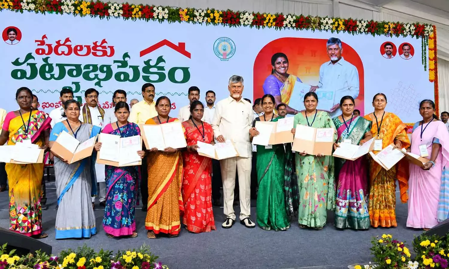Chief Minister N Chandrababu Naidu distributing regularised house-site pattas at Ajith Singh Nagar in Vijayawada on Wednesday Chief Minister N Chandrababu Naidu distributing regularised house-site pattas at Ajith Singh Nagar in Vijayawada on Wednesday