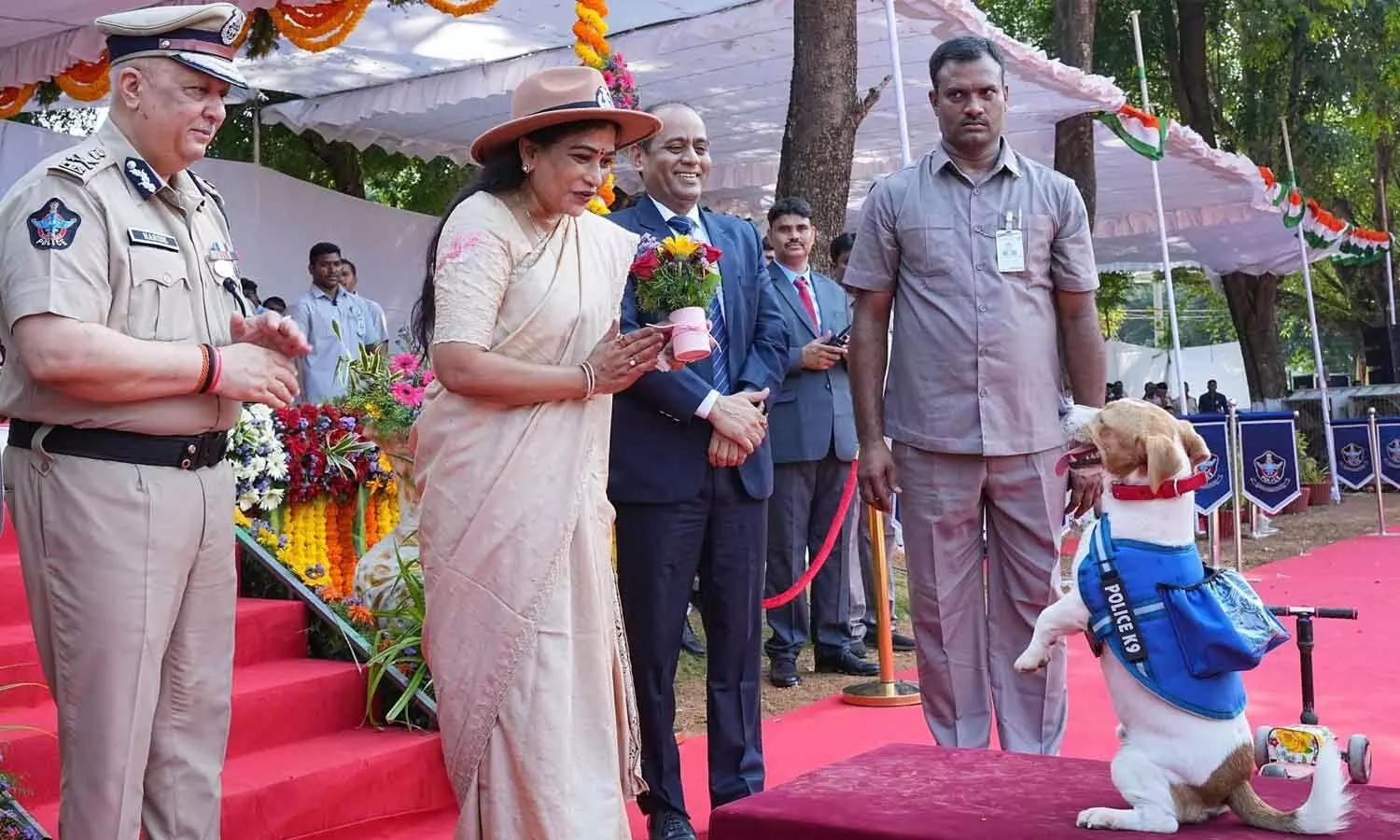 Home minister V Anitha appreciates the skills of a police dog at the passing-out parade of the 23rd batch of canines and handlers at the ISW Canine Training Centre in Mangalagiri on Wednesday. DGP Harish Kumar Gupta is also seen. Home minister V Anitha appreciates the skills of a police dog at the passing-out parade of the 23rd batch of canines and handlers at the ISW Canine Training Centre in Mangalagiri on Wednesday. DGP Harish Kumar Gupta is also seen.