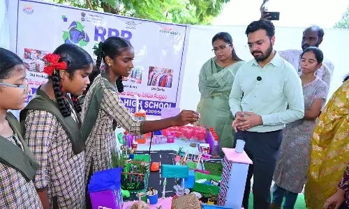 Students displaying a project on recycling at an exhibition at Sri Venkateswara Anam Kalakendram in Rajamahendravaram on Wednesday