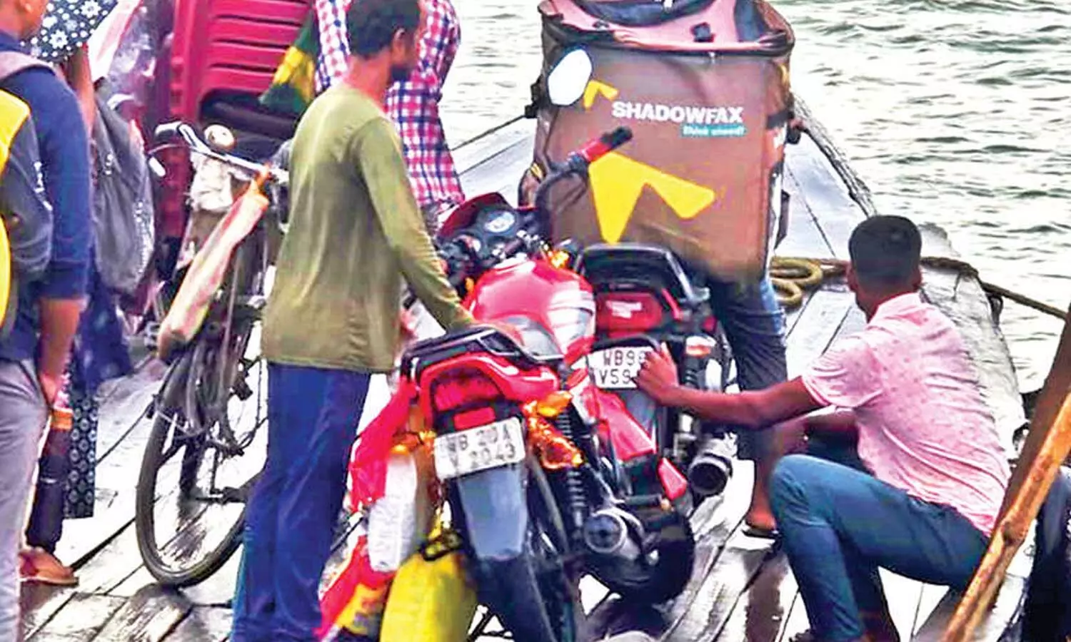 No roads? The delivery bike takes a boat No roads? The delivery bike takes a boat