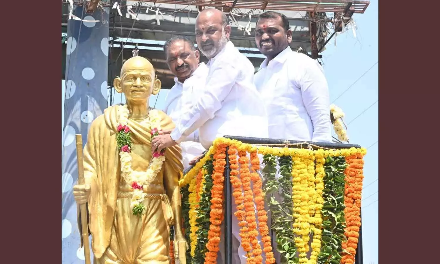 Union Minister of State for Home Affairs Bandi Sanjay Kumar paid floral tributes to Mahatma Gandhi at his statue in Jammikunta on Friday Union Minister of State for Home Affairs Bandi Sanjay Kumar paid floral tributes to Mahatma Gandhi at his statue in Jammikunta on Friday