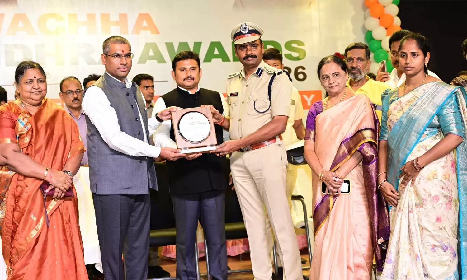 District Collector Dr S Venkateswar presenting award to an employee in Tirupati on Friday District Collector Dr S Venkateswar presenting award to an employee in Tirupati on Friday