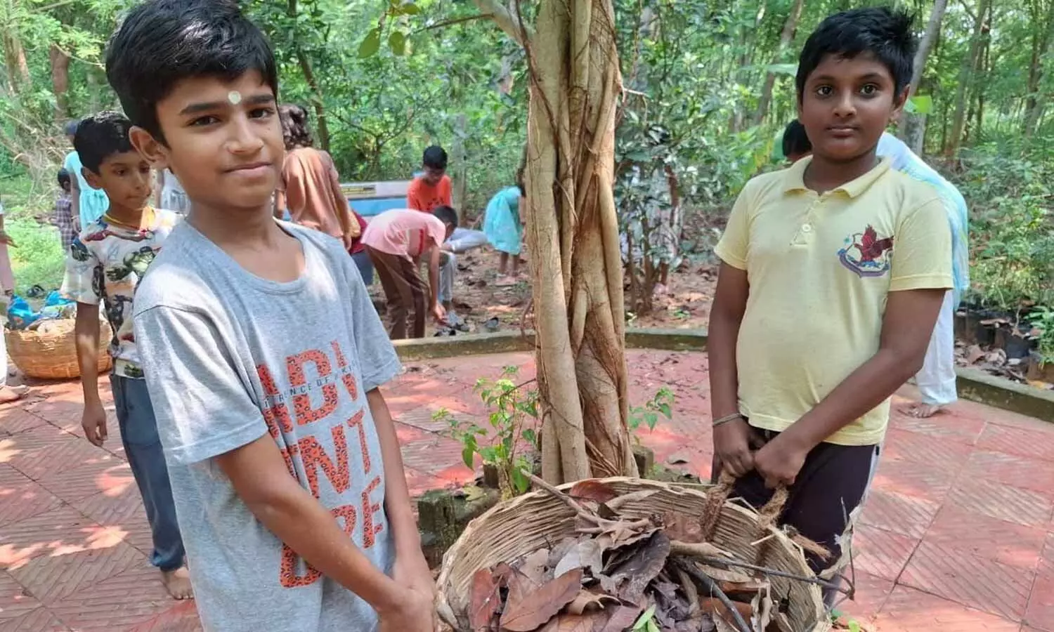 Holding baskets, children pick up litter as part of the cleanliness drive organised by Sri Sathya Sai Seva Organisations in Visakhapatnam on Sunday Holding baskets, children pick up litter as part of the cleanliness drive organised by Sri Sathya Sai Seva Organisations in Visakhapatnam on Sunday