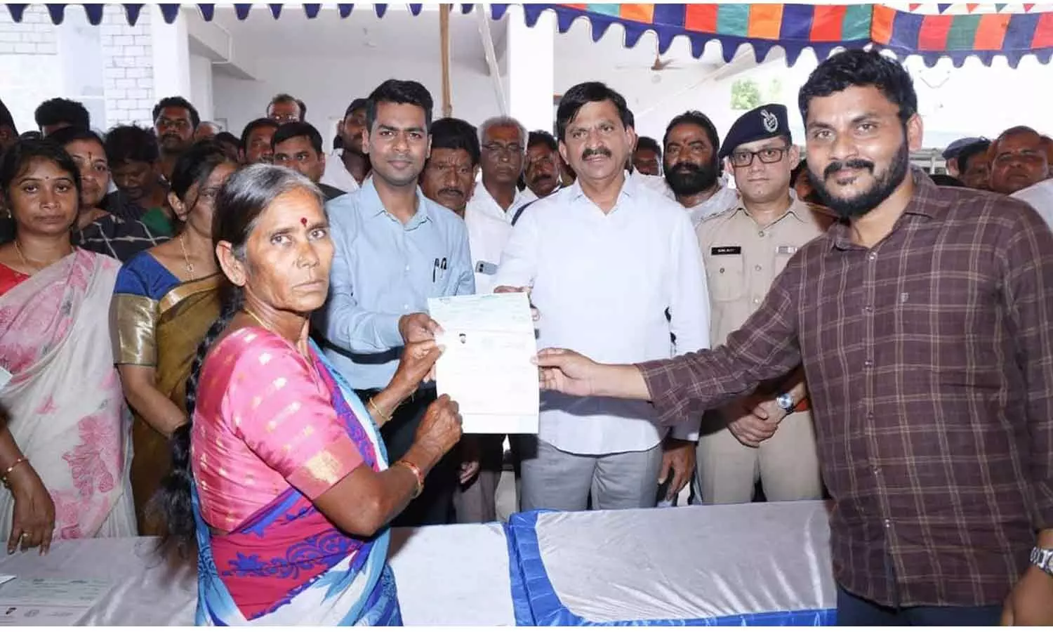 Ponguleti distributeS cheques to beneficiaries Ponguleti distributeS cheques to beneficiaries