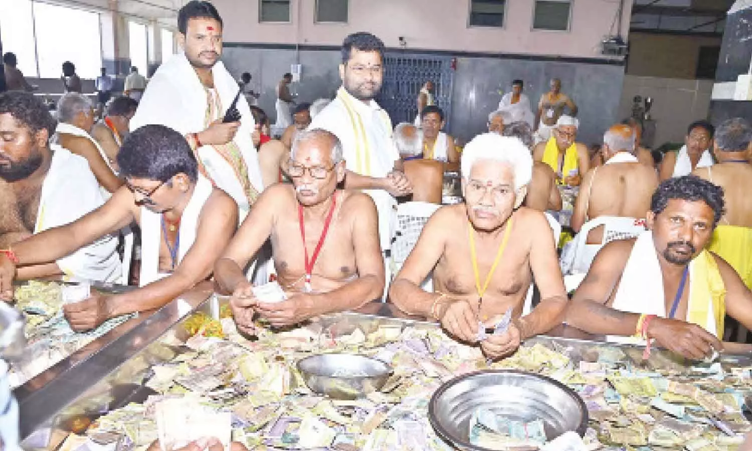 Temple Executive Officer VK Seena Naik supervising hundi counting at the Mallikarjuna Maha Mandapam atop Indrakeeladri in Vijayawada on Wednesday Temple Executive Officer VK Seena Naik supervising hundi counting at the Mallikarjuna Maha Mandapam atop Indrakeeladri in Vijayawada on Wednesday