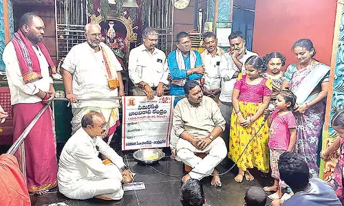 Endowments Commissioner Ramachandra Mohan interacting with children at Bala Vikasa Kendram in Bodapadu, Nunna, on Tuesday