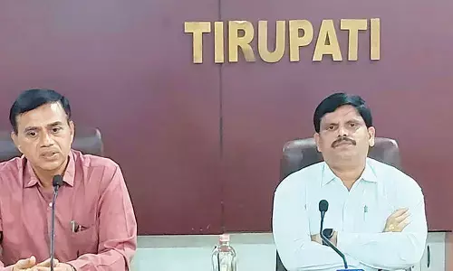 Joint Collector R Govinda Rao and Social Forestry Officer Pavan Kumar at the review meeting in Tirupati on Friday