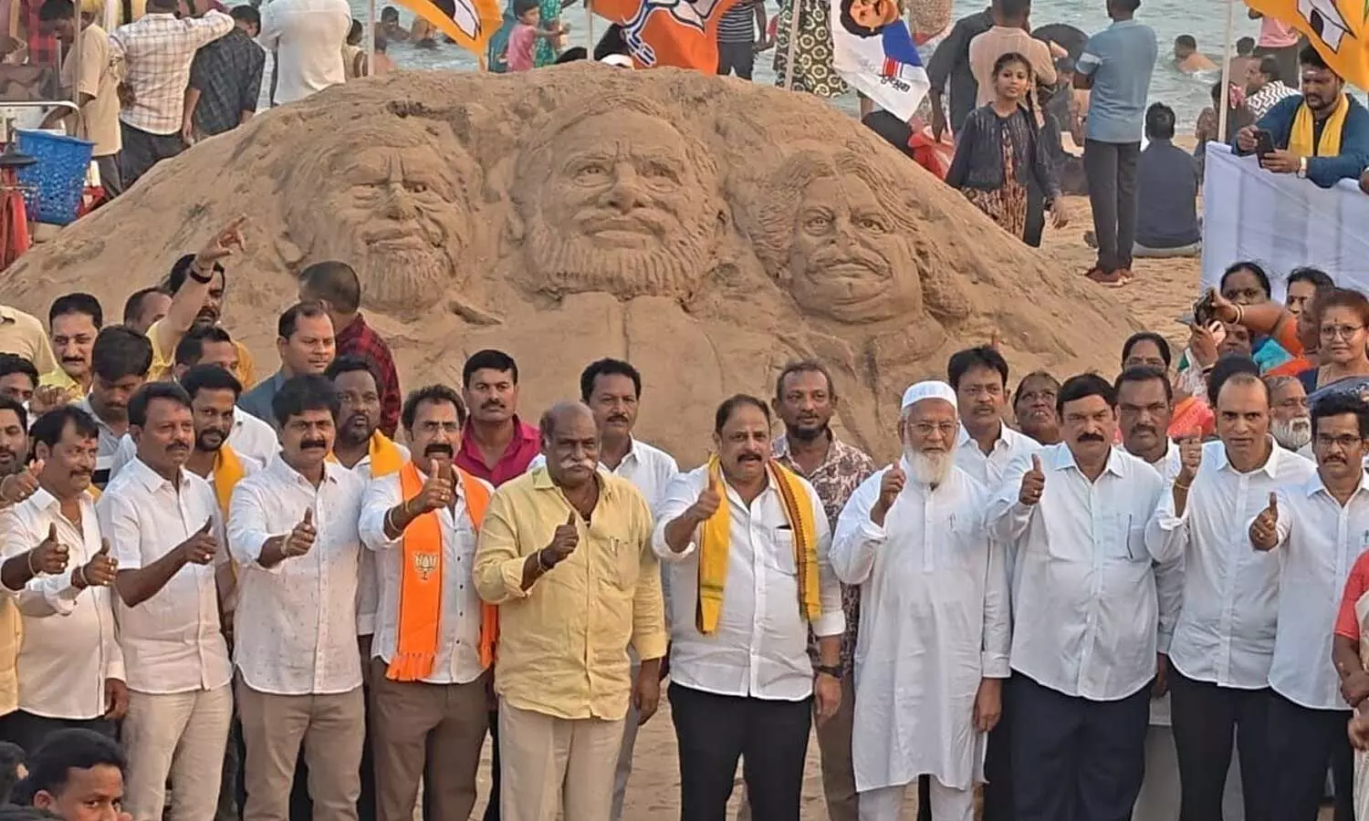 Public representatives, alliance leaders and others at the sand sculpture crafted on the occasion of commemorating Prime Minister Narendra Modi’s 25 years of public service in Visakhapatnam on Sunday Public representatives, alliance leaders and others at the sand sculpture crafted on the occasion of commemorating Prime Minister Narendra Modi’s 25 years of public service in Visakhapatnam on Sunday