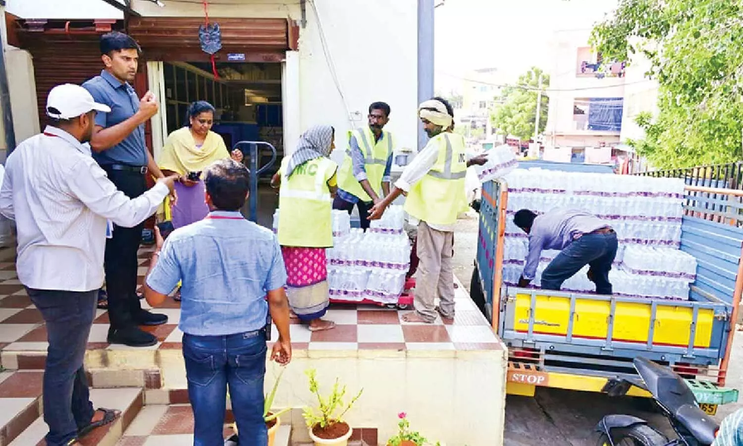 VMC Commissioner HM Dhyanachandra inspecting the supply of drinking water bottles for devotees during the Dasara Sarannavaratri festivities in Vijayawada on Sunday VMC Commissioner HM Dhyanachandra inspecting the supply of drinking water bottles for devotees during the Dasara Sarannavaratri festivities in Vijayawada on Sunday