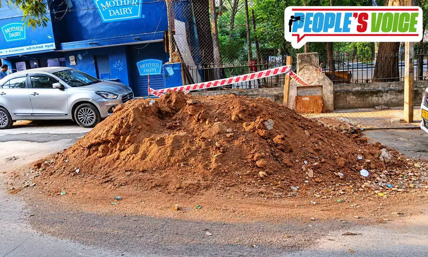 Mud in the middle of the road leaves pedestrians in a muddle Mud in the middle of the road leaves pedestrians in a muddle
