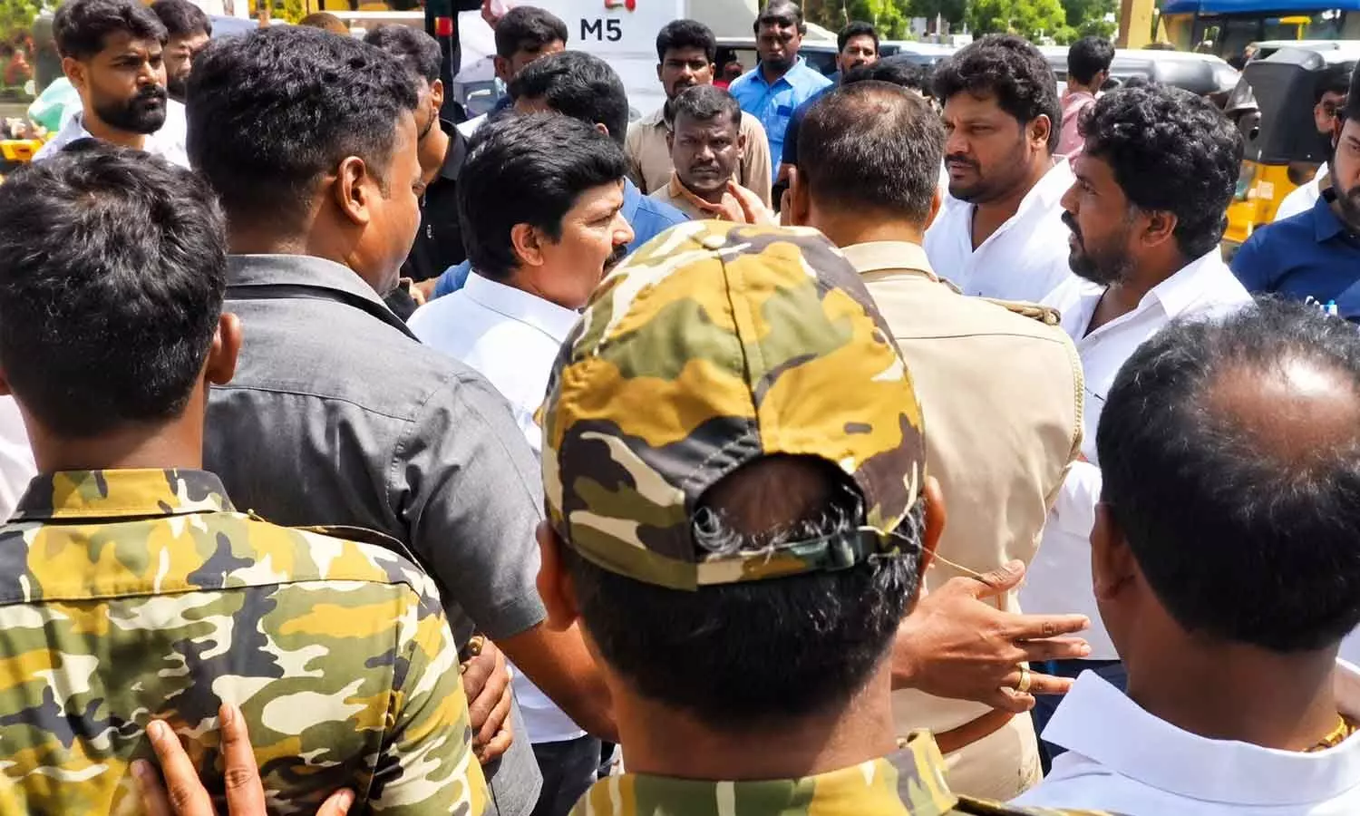 Tirupati MP Dr Maddila Gurumurthy and MLC Cipai Subramanyam arguing with police officials after being blocked by opposing party workers outside the Municipal Corporation office on Saturday Tirupati MP Dr Maddila Gurumurthy and MLC Cipai Subramanyam arguing with police officials after being blocked by opposing party workers outside the Municipal Corporation office on Saturday