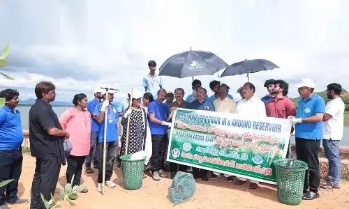 State Information Commissioner PS Naidu and others participating in the reservoir cleaning drive in Visakhapatnam on Saturday