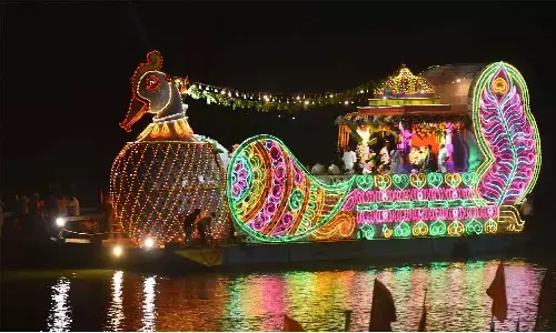 Teppotsavam of Sri Durga Malleswara Swamy Varla Devasthanam aboard Hamsa Vahanam on Krishna river in Vijayawada on Tuesday Teppotsavam of Sri Durga Malleswara Swamy Varla Devasthanam aboard Hamsa Vahanam on Krishna river in Vijayawada on Tuesday