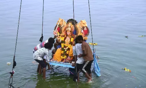 Durga idols being immersed in Hussain Sagar in Hyderabad on Wednesday Photos: Adula Krishna