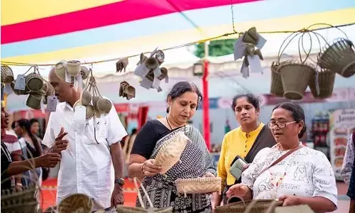 Visitors shop at the Saras Mela at Punnami Ghat in Vijayawada