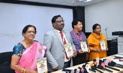 Dr NTR University of Health Sciences vice-chancellor Dr P Chandrasekhar along with registrar Dr T Sai Sudheer and other officials release the details of the Ruby Jubilee celebrations at a press conference in Vijayawada on Friday