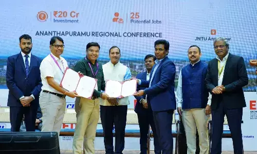 Officials and entrepreneurs exchange copies of MoUs at Anantapur Regional Conference organised by CII and the state government at JNTU-A on Friday