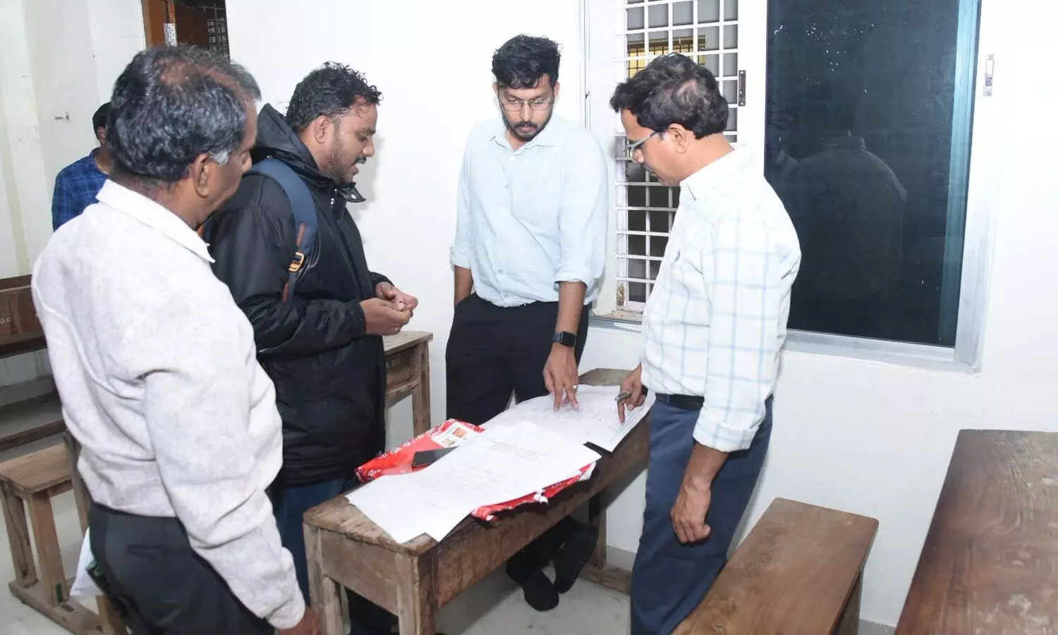 District Joint Collector Adarsh Rajendran reviewing layout maps and administrative blueprints with revenue and municipal officials during an on-site inspection of the PVKN Degree College counting centre on Sunday District Joint Collector Adarsh Rajendran reviewing layout maps and administrative blueprints with revenue and municipal officials during an on-site inspection of the PVKN Degree College counting centre on Sunday