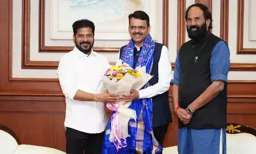 Chief Minister A Revanth Reddy greets Maharashtra CM Devendra Fadnavis in Mumbai on Monday. TG Irrigation Minister Uttam Kumar Reddy is also seen