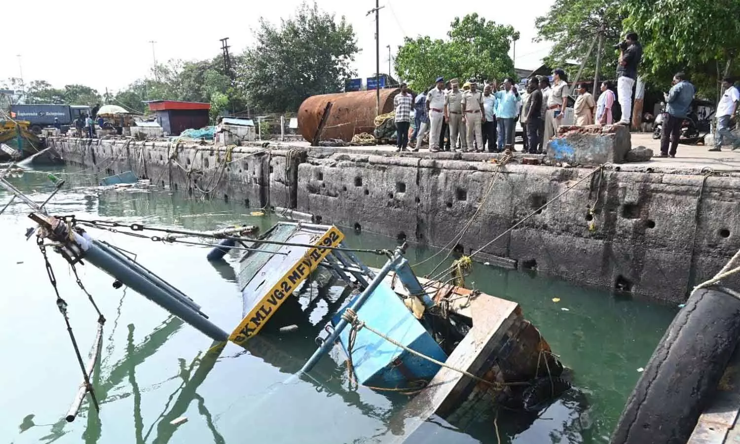 Coastal Security IGP Gopinath Jetti along with others inspecting cyclone-damaged boats at Visakhapatnam Fishing Harbour on Thursday Coastal Security IGP Gopinath Jetti along with others inspecting cyclone-damaged boats at Visakhapatnam Fishing Harbour on Thursday