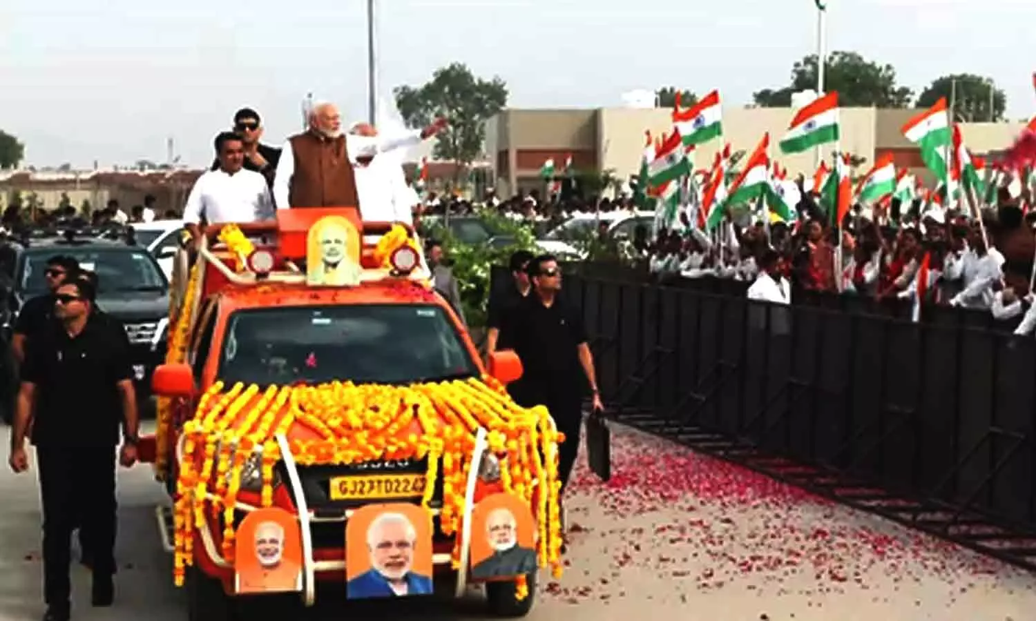 Large crowd greets PM Modi during roadshow in Gujarats Banaskantha Large crowd greets PM Modi during roadshow in Gujarats Banaskantha