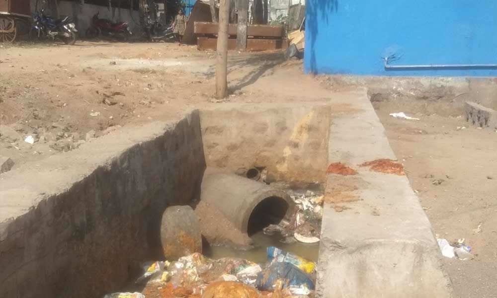 Open nala choked with garbage in Vanasthalipuram