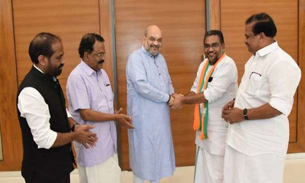 Former Kerala PSC chairman Radhakrishnan joins BJP