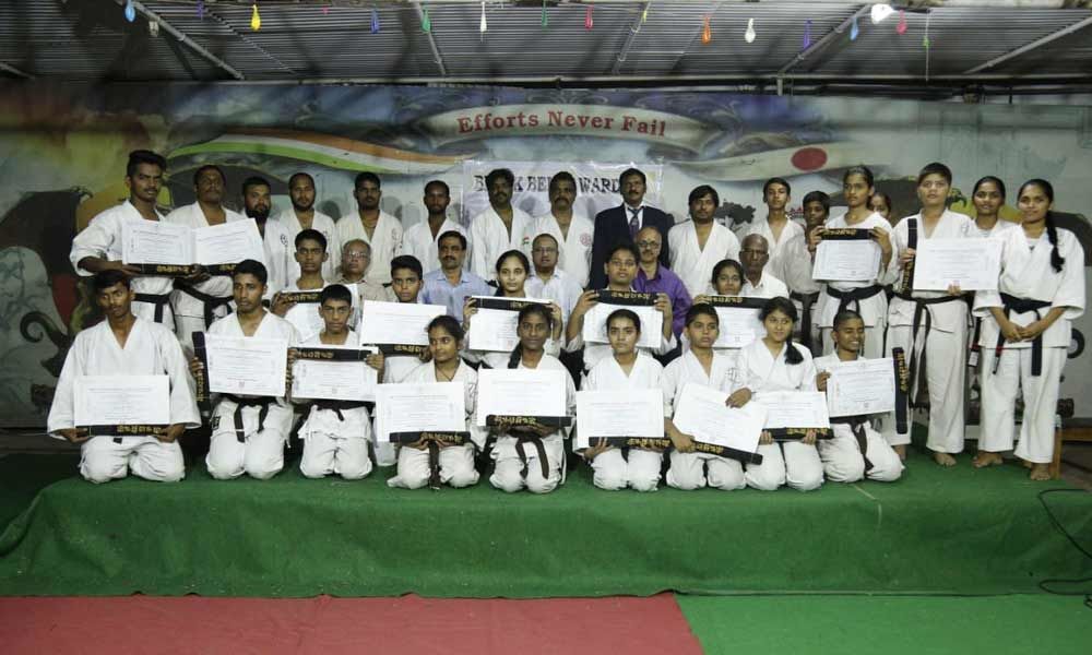 Karate students presented black belts