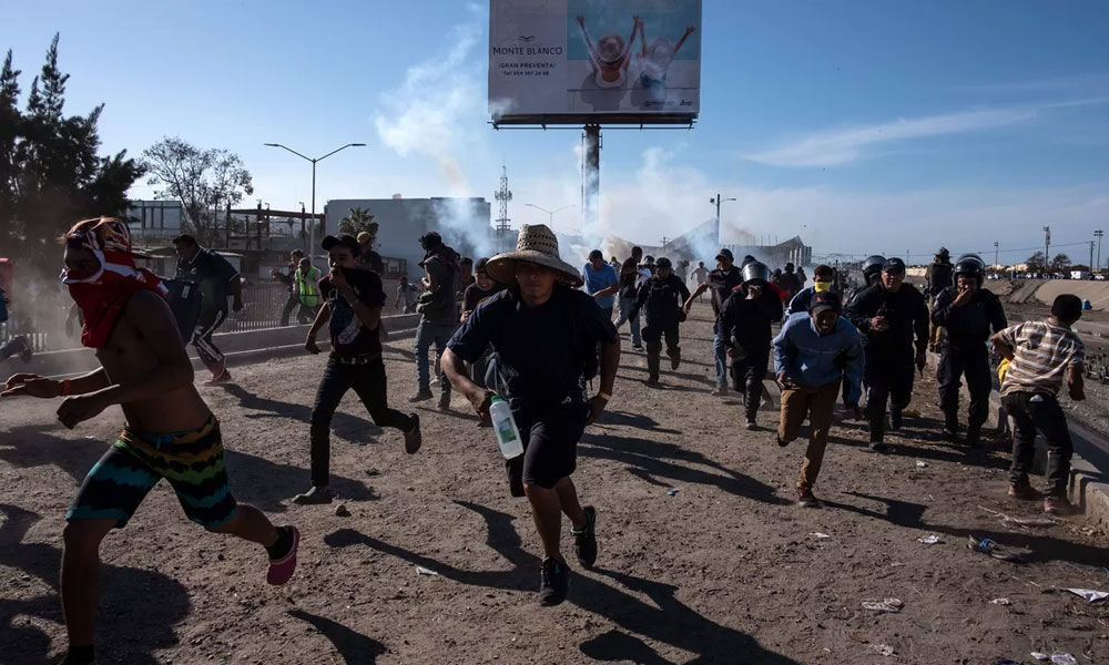 US border agents fire tear gas at Central American migrants