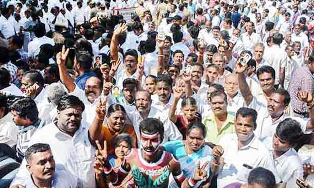 AIADMK supporters protesting against AMMK candidate P Vetrivel