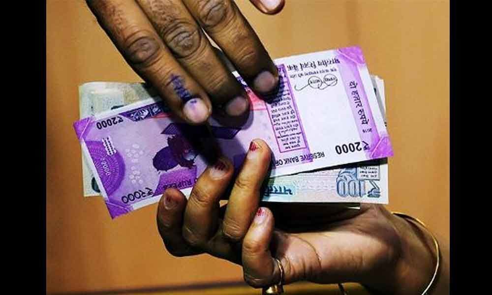 People caught while distributing cash to voters