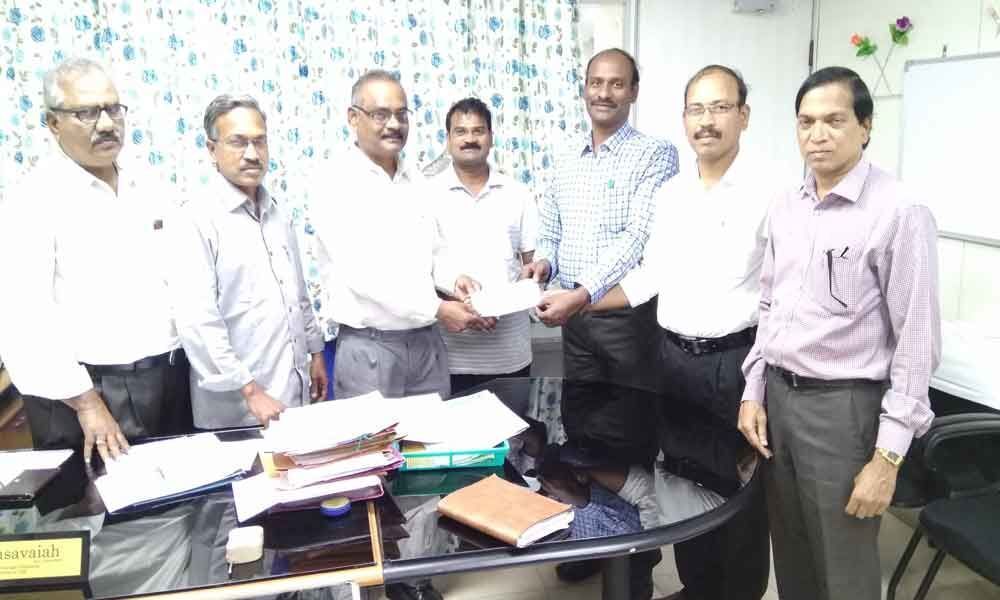 SCCL donates 1.5 L to Vanavasi Kalyana Parishad