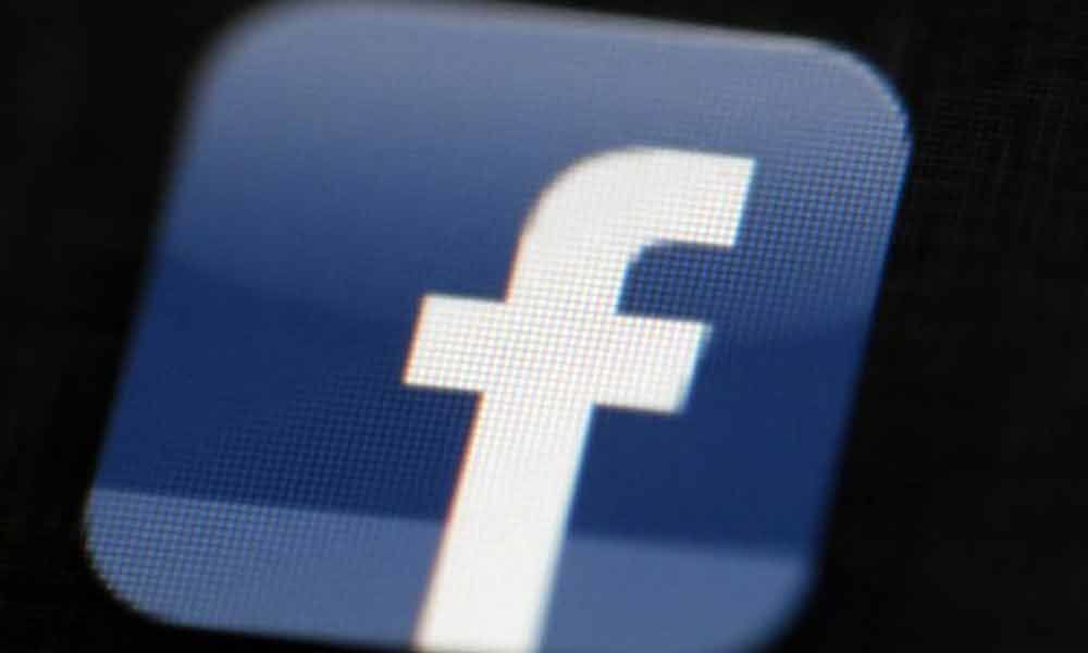 Britain plans social media watchdog to battle harmful content