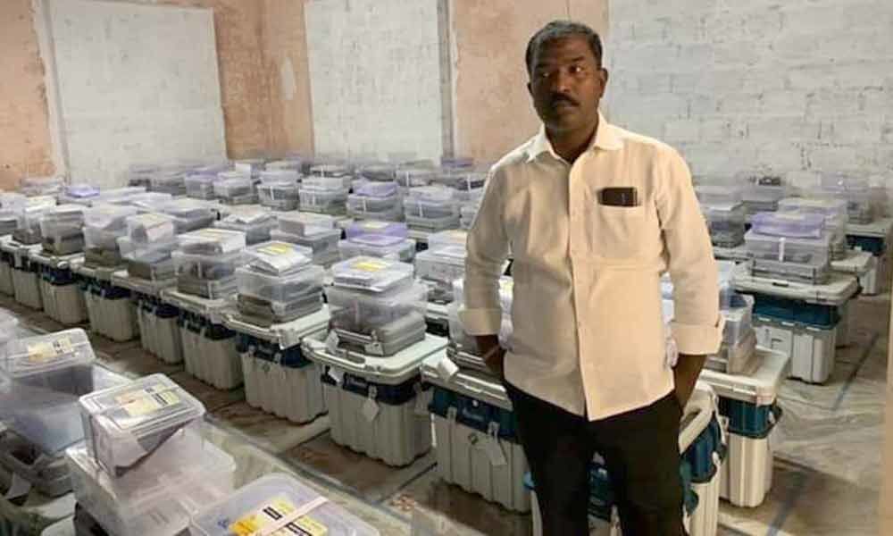 Picture of TRS leader posing in front of EVMs sparks uproar