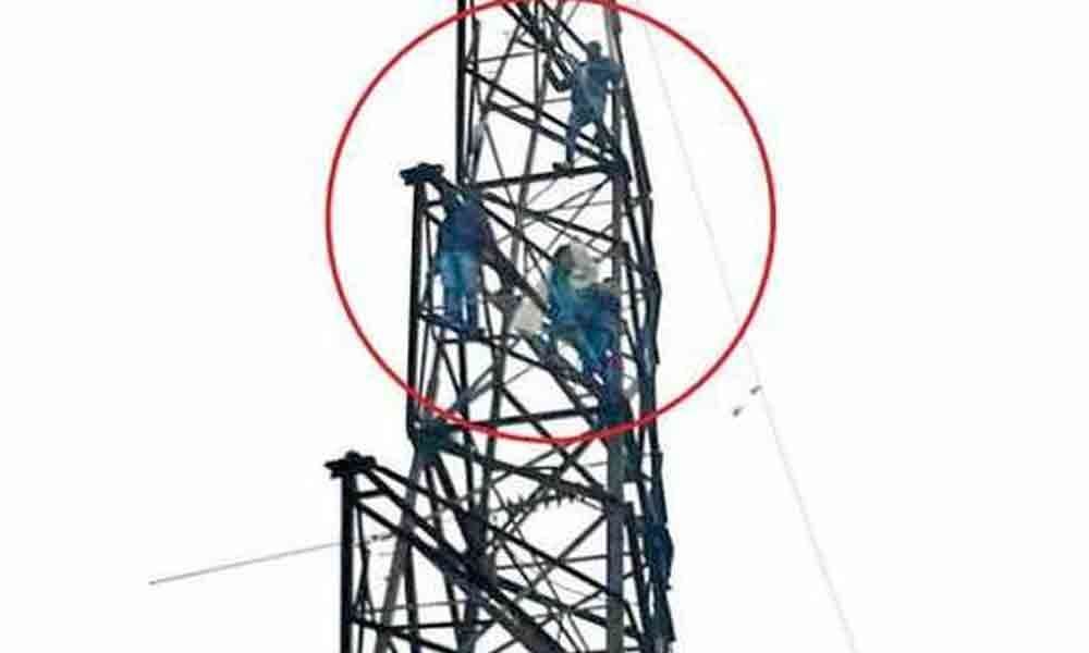 Tension in Tripuraram as youth climbs high tension electric tower