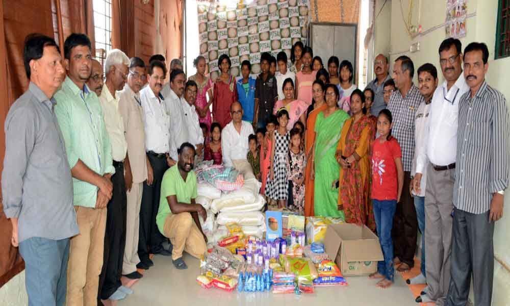 PJTSAU staff gesture to orphanages
