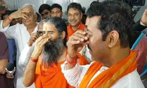Ramdev performs yoga antics as Rajyavardhan Singh Rathore files papers