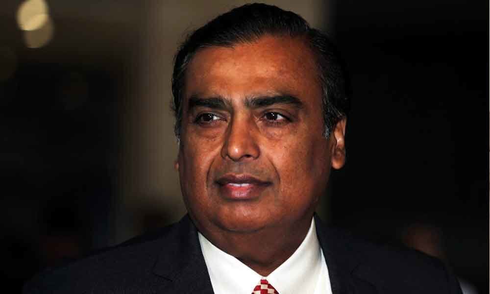 Indias richest man Mukesh Ambani backs candidate from Congress party