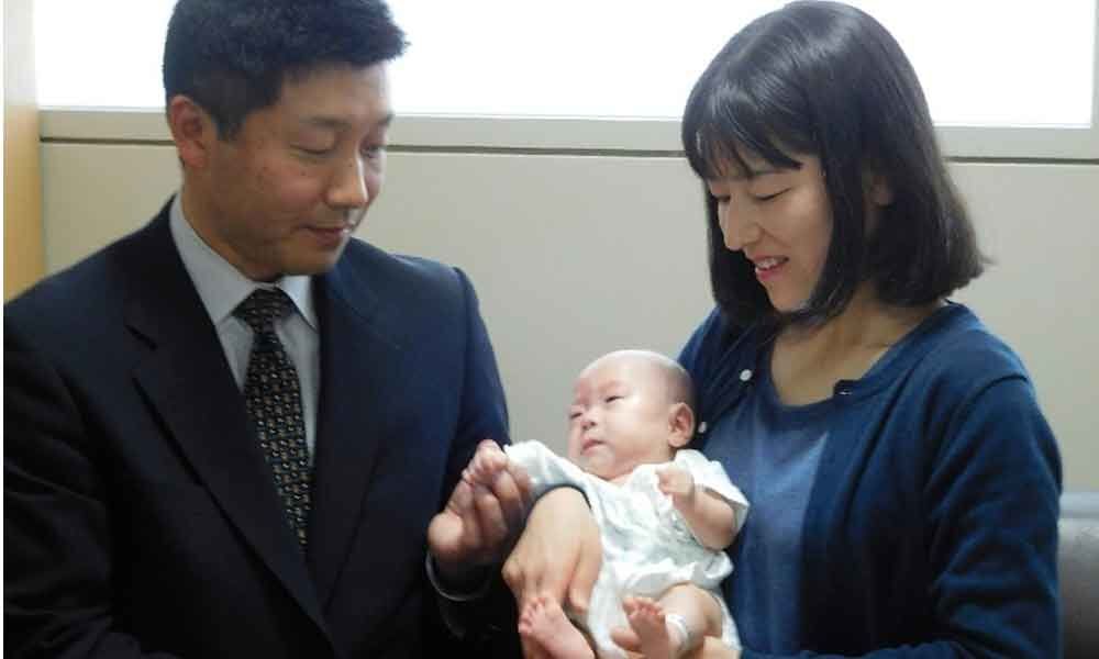 Japanese couple take home worlds smallest baby boy