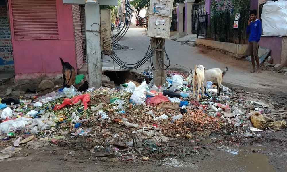 People clean up road as GHMC fails to act