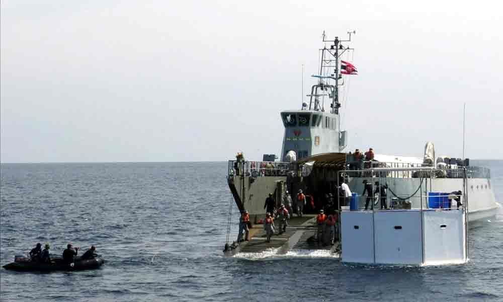 Thai navy tows floating home of fugitive U.S. seasteader